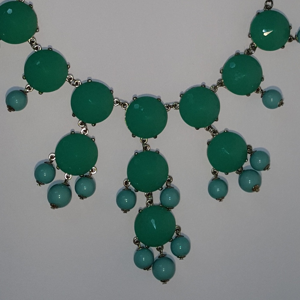 Turquoise with round pendants.